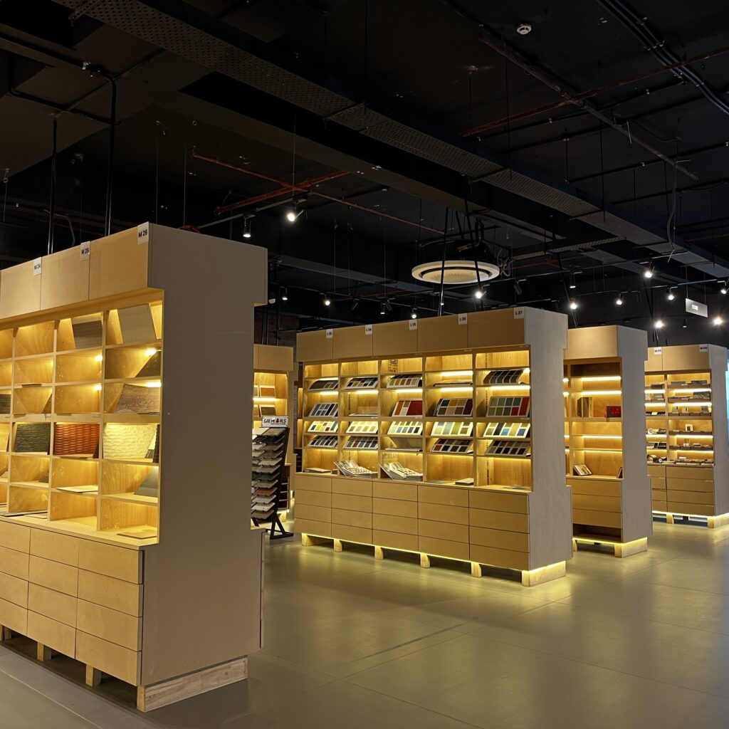 Material library shelves at Knowledge Center, Gurugram, with 120 brand samples